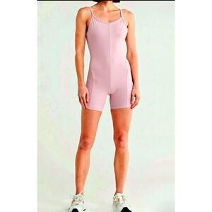 NWT Yogalicious Lux Lotus Romper.  First Bloom Pink color. Size S. Retails $72